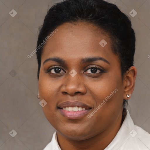 Joyful black young-adult female with short  brown hair and brown eyes