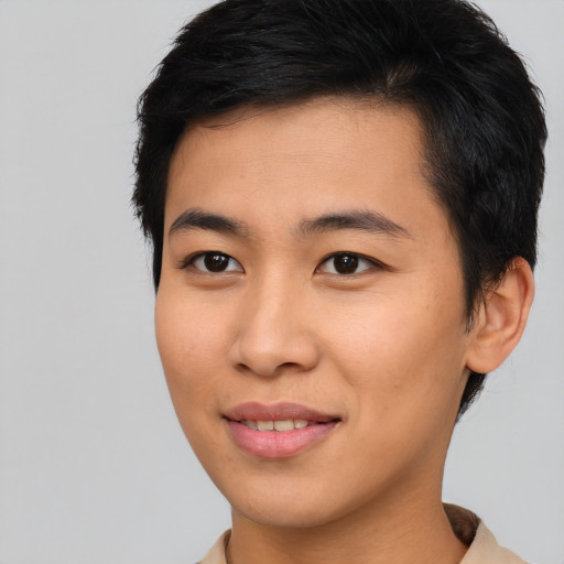 Joyful asian young-adult male with short  brown hair and brown eyes