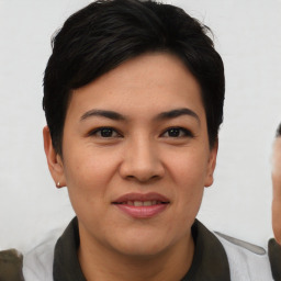 Joyful asian young-adult female with short  black hair and brown eyes