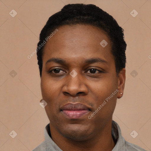 Joyful black adult male with short  black hair and brown eyes