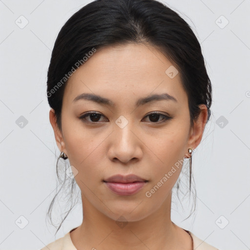 Joyful asian young-adult female with medium  black hair and brown eyes