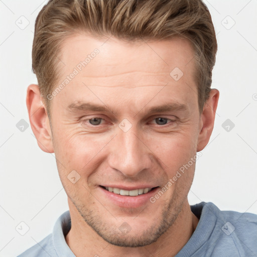 Joyful white adult male with short  brown hair and grey eyes