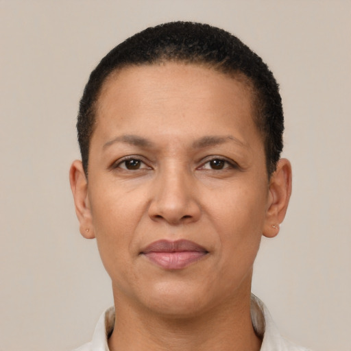Joyful latino adult female with short  brown hair and brown eyes