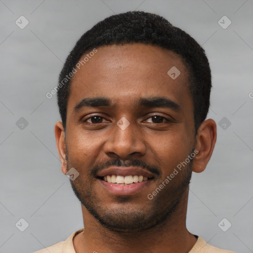 Joyful black young-adult male with short  black hair and brown eyes