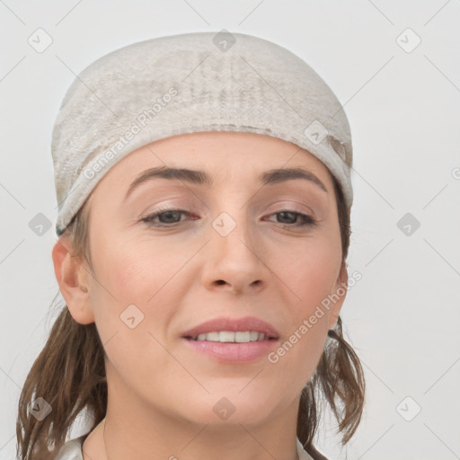 Joyful white young-adult female with medium  brown hair and blue eyes