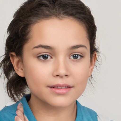 Joyful white child female with medium  brown hair and brown eyes