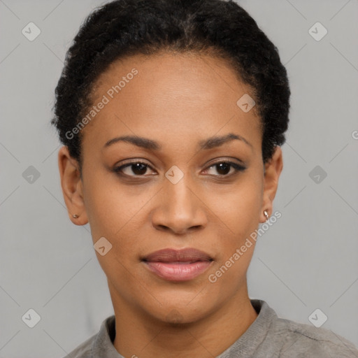 Joyful black young-adult female with short  black hair and brown eyes