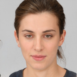 Neutral white young-adult female with medium  brown hair and brown eyes