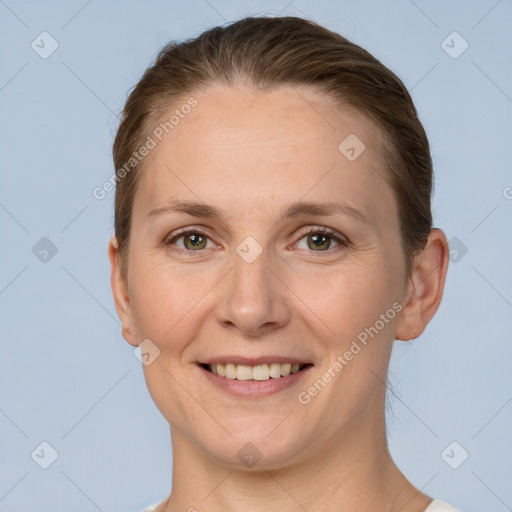 Joyful white adult female with short  brown hair and grey eyes