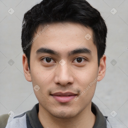 Joyful asian young-adult male with short  black hair and brown eyes