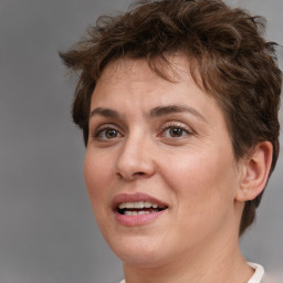 Joyful white adult female with short  brown hair and brown eyes