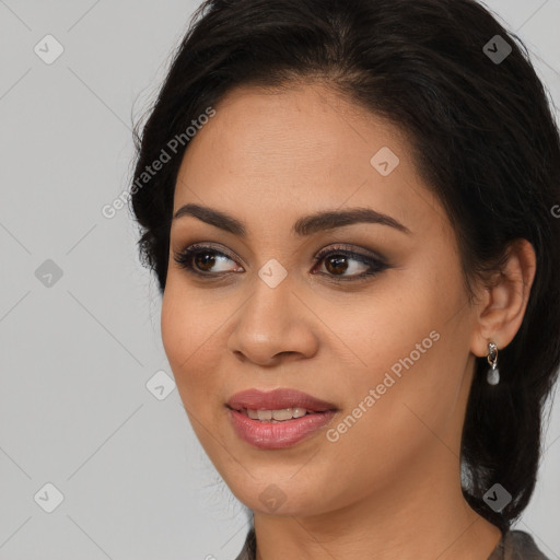 Joyful latino young-adult female with long  brown hair and brown eyes