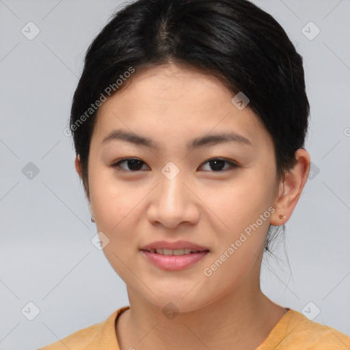 Joyful asian young-adult female with short  brown hair and brown eyes