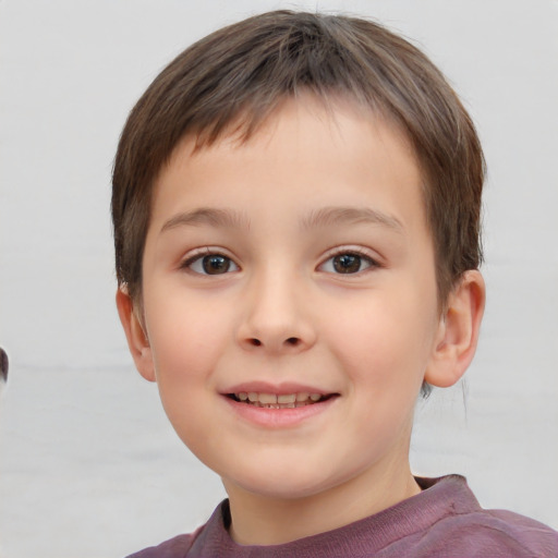 Joyful white child male with short  brown hair and brown eyes