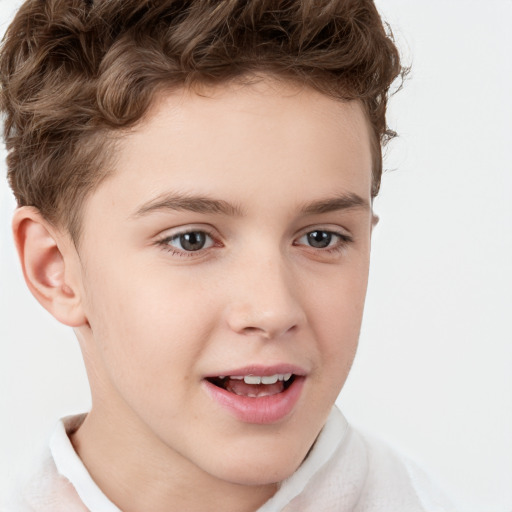 Joyful white child male with short  brown hair and brown eyes