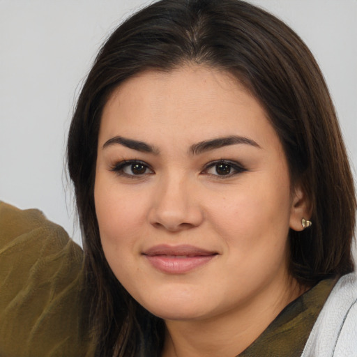Joyful white young-adult female with medium  brown hair and brown eyes