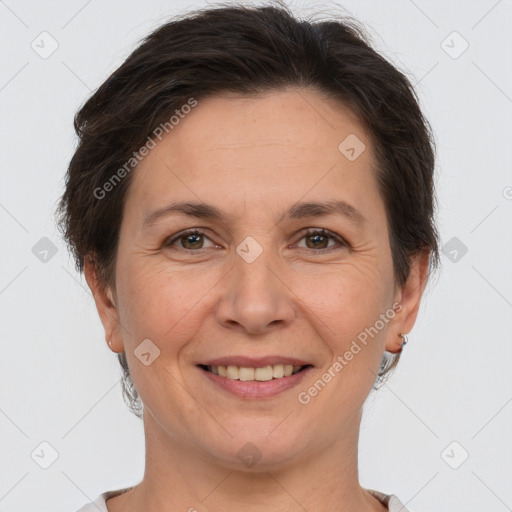 Joyful white adult female with short  brown hair and brown eyes