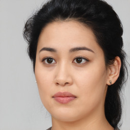 Joyful asian young-adult female with medium  black hair and brown eyes