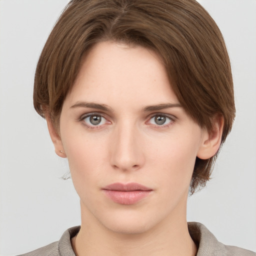 Neutral white young-adult female with short  brown hair and grey eyes