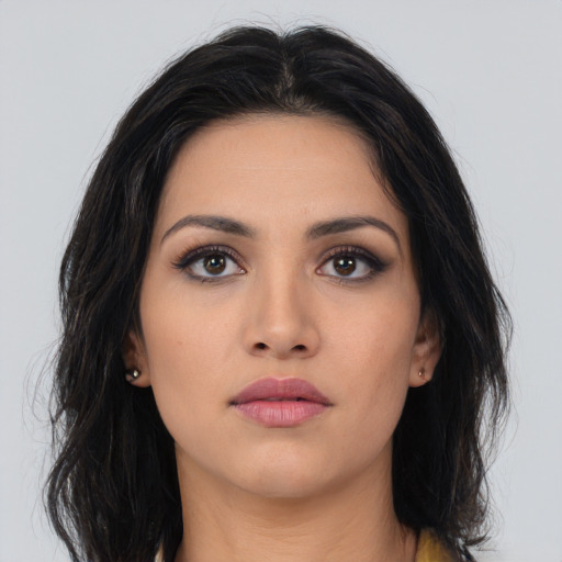 Neutral latino young-adult female with long  brown hair and brown eyes
