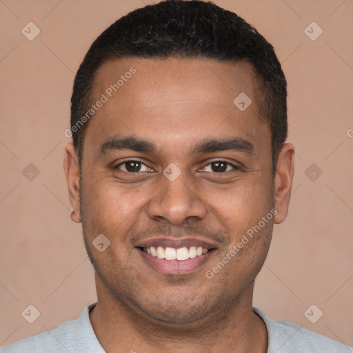 Joyful latino young-adult male with short  brown hair and brown eyes