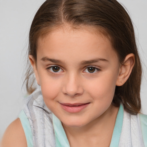 Joyful white child female with medium  brown hair and brown eyes