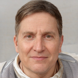 Joyful white middle-aged male with short  brown hair and brown eyes