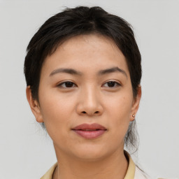 Joyful asian young-adult female with short  brown hair and brown eyes