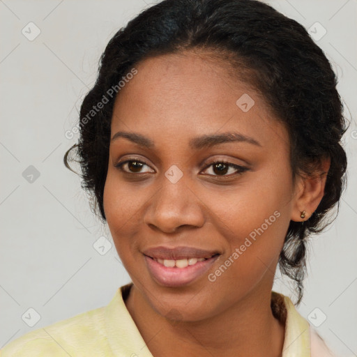 Joyful black young-adult female with medium  brown hair and brown eyes