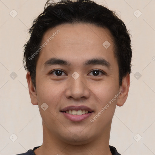 Joyful latino young-adult male with short  brown hair and brown eyes