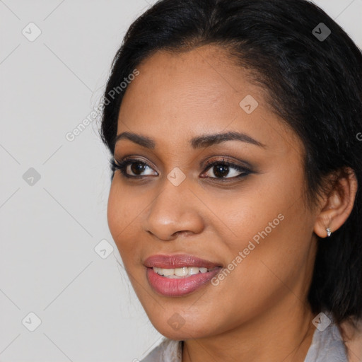 Joyful latino young-adult female with medium  brown hair and brown eyes