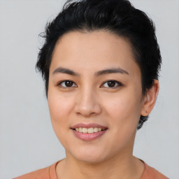 Joyful asian young-adult female with short  black hair and brown eyes