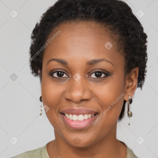 Joyful black young-adult female with short  brown hair and brown eyes