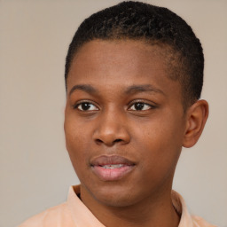 Joyful black young-adult male with short  brown hair and brown eyes