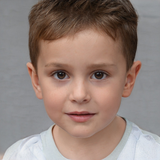 Joyful white child male with short  brown hair and brown eyes