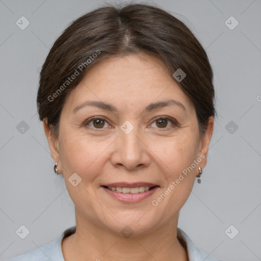 Joyful white adult female with short  brown hair and brown eyes