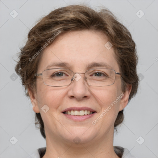 Joyful white adult female with short  brown hair and grey eyes