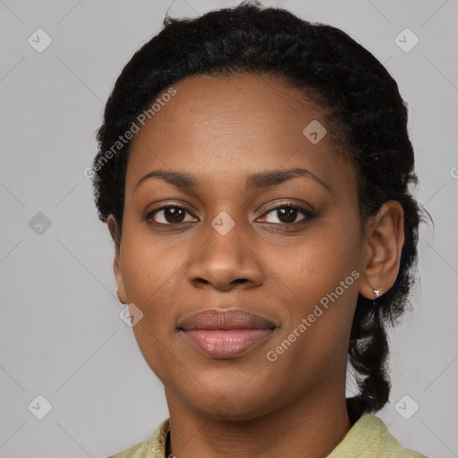 Joyful black young-adult female with medium  black hair and brown eyes