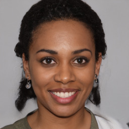 Joyful latino young-adult female with medium  black hair and brown eyes