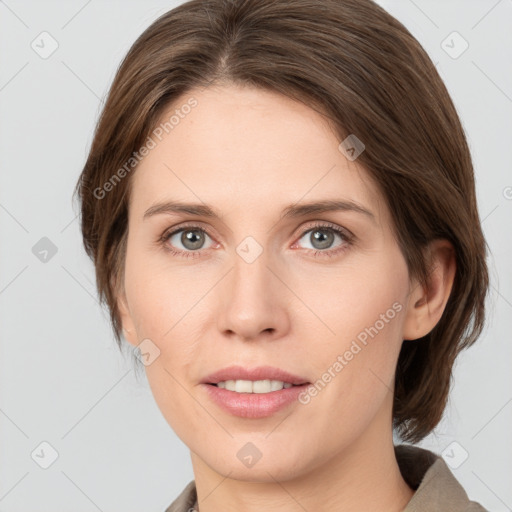 Joyful white young-adult female with medium  brown hair and grey eyes