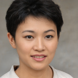 Joyful asian young-adult female with short  brown hair and brown eyes