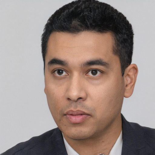 Neutral latino young-adult male with short  black hair and brown eyes