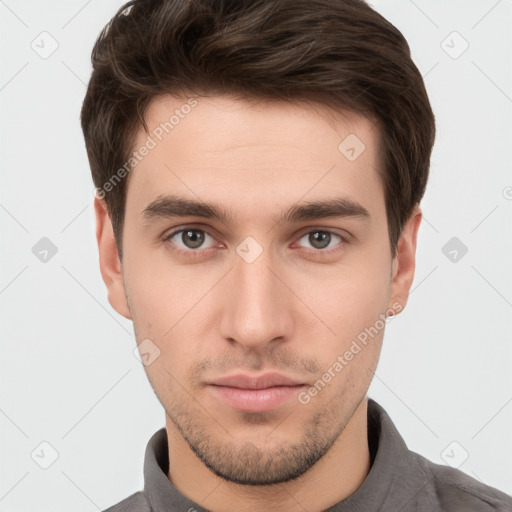 Neutral white young-adult male with short  brown hair and brown eyes