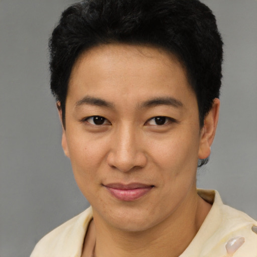 Joyful latino young-adult female with short  black hair and brown eyes