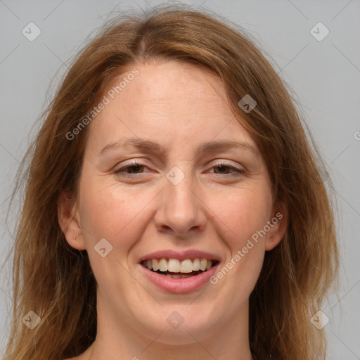 Joyful white adult female with medium  brown hair and brown eyes