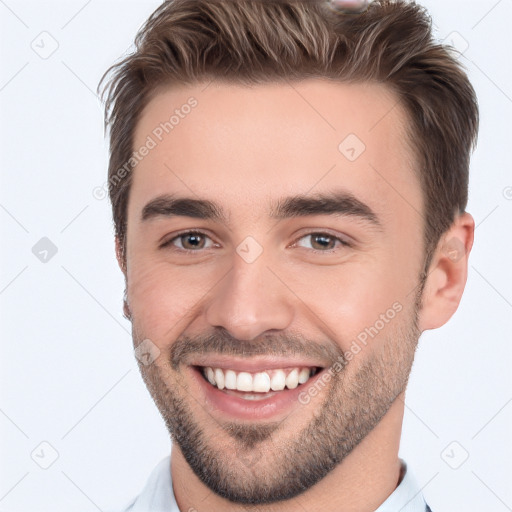 Joyful white young-adult male with short  brown hair and brown eyes