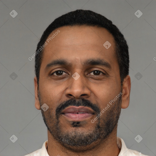 Neutral latino adult male with short  black hair and brown eyes