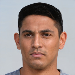 Neutral white young-adult male with short  black hair and brown eyes