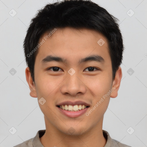 Joyful asian young-adult male with short  brown hair and brown eyes