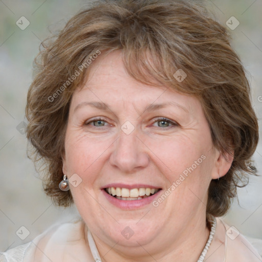 Joyful white adult female with medium  brown hair and blue eyes